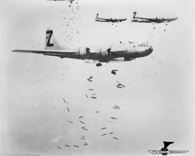Other cities were also targeted. Following up on the Tokyo raid, B-29s from 500th Bomb Group, 73rd Bomb Wing, drop incendiary bombs—dubbed “Molotov flower baskets”—on Yokohama, near Tokyo, May 1945.