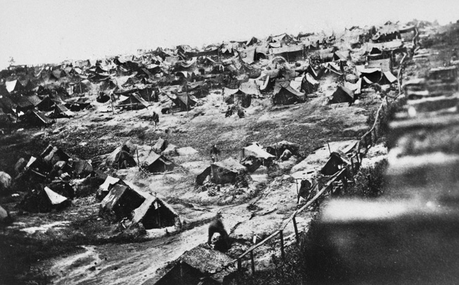 A closer view of the squalid conditions at Andersonville, August 1864. The notorious “dead line” can be seen at the right. Anyone crossing it was shot on sight.