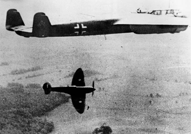 A Spitfire shadows a German Dornier 17 light bomber shortly after the Battle of Britain as enemy daylight raids against England became fewer.