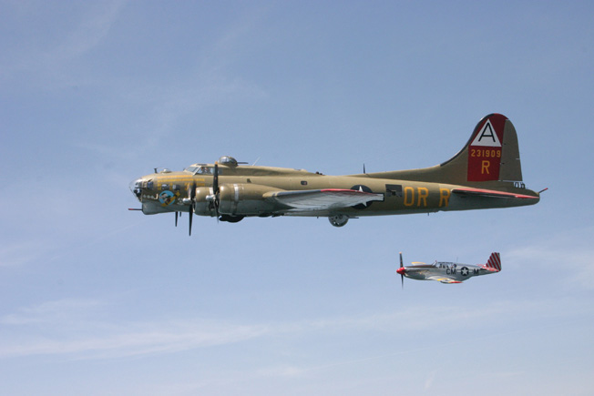 The B-17 “Nine-O-Nine” and the P-51C Mustang “Betty Jane” in flight.