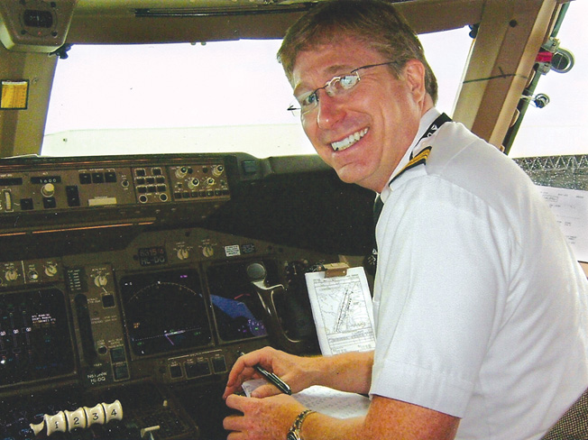 Delta Airlines pilot Robert Trammell in his usual “office”—the cockpit of a Boeing 747-400. 