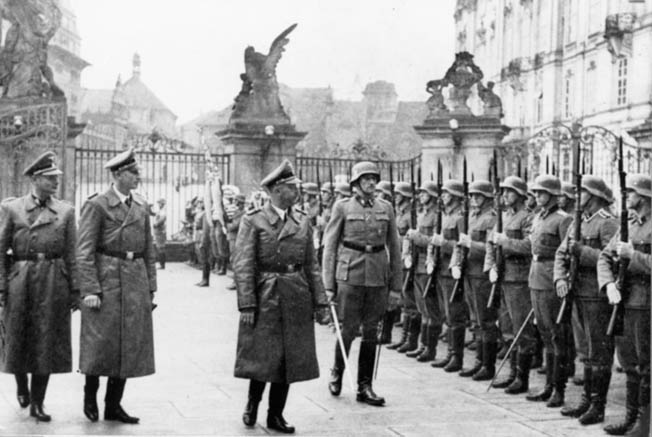 September 1941: Himmler and Reinhard Heydrich (second from left), the military governor of Czechoslovakia and the person who carried out many of Himmler’s most diabolical schemes (such as the Holocaust), review SS guards at the Hradcany Palace in Prague. Heydrich was ambushed by Czech partisans the following May and died of his wounds.