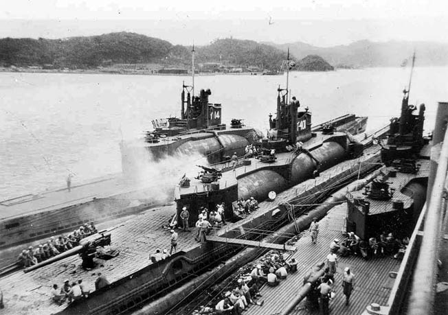 The Japanese aircraft carrier submarines I-14, I-400, and I-401 are shown in Tokyo Bay at the end of the war. The submarines were destined to be sunk in Hawaiian waters during U.S. Navy torpedo tests.