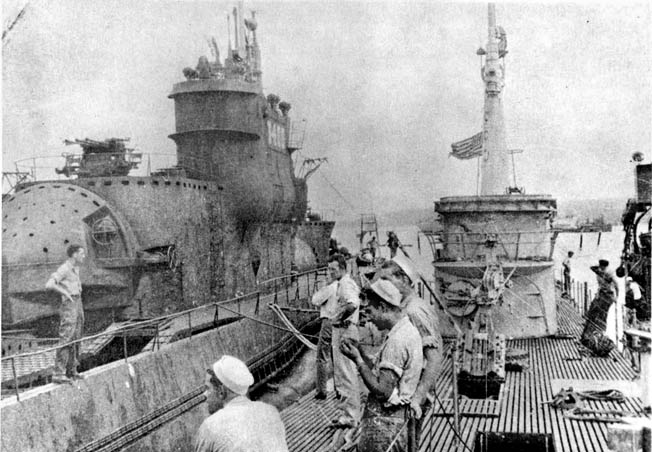 A object of great curiosity, the I-400 attracted considerable attention from American submariners from the much smaller USS Blower in Tokyo Bay.