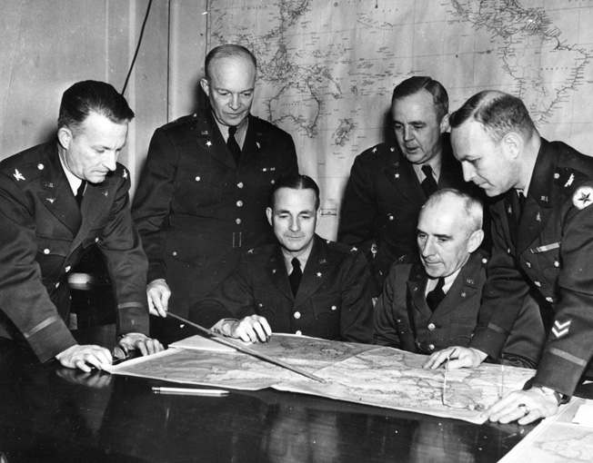 A War Plans Board meeting, May 1942. Shown are (left to right) Colonel St. C. Street, Ike, Cololnel A.S. Nevins, Brig. Gen. R.C. Crawford, Colonel C.A. Russell, and Colonel H. A. Barber, Jr.