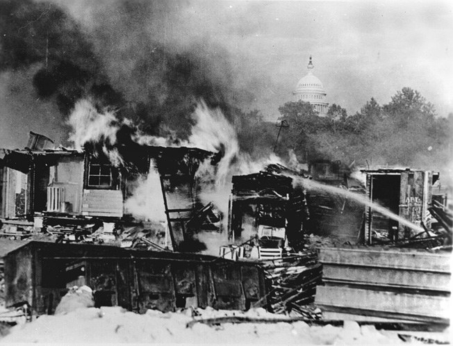 Shacks constructed on the Anacostia Flats by the so-called “Bonus Army” in Washington, D.C., ablaze after an ugly confrontation with the U.S. Army, summer 1932. 