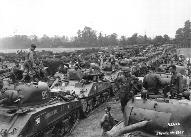 Men of General Jacques-Philippe Leclerc’s 2nd French Armored Division, driving Shermans and wearing American uniforms, are shown shortly after arriving in France at Normandy and before beginning the liberation of their homeland.