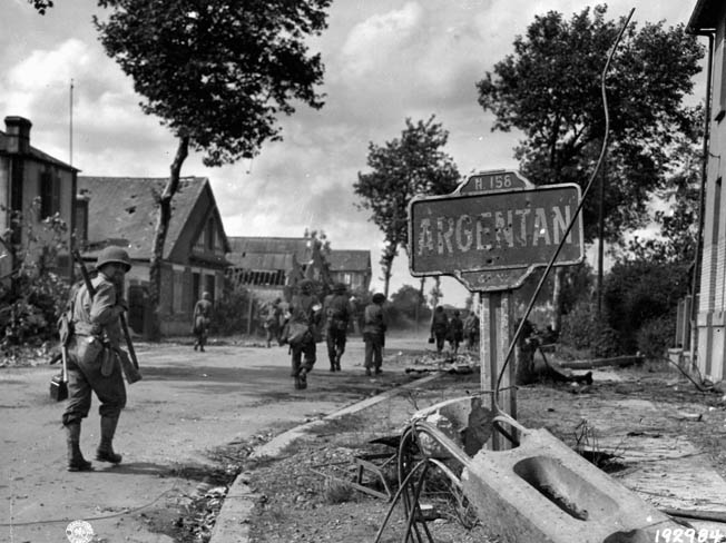 GIs enter the damaged French village of Argentan, August 20, 1944, where the closing of the gap came too late to prevent the German withdrawal from being partially successful.