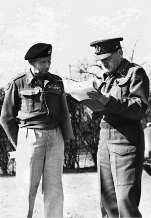 Montgomery (left) and “Freddie” De Guingand, his chief of staff, review a document. It was De Guingand who passed the order instructing the Americans to halt and not close the gap at Falaise.