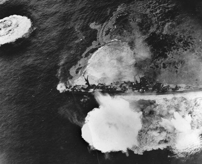 All Japanese ships were fair game at Okinawa. Here a light cruiser of the Agano class is pummeled by American warplanes.