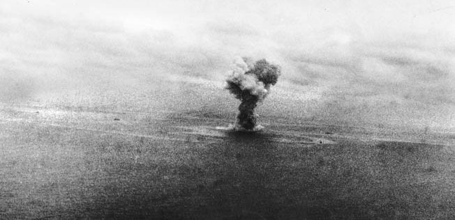 Hit by eight aerial torpedoes, the Yamato explodes in a giant plume of smoke and fire. Only 592 of her 3,332-man crew survived.