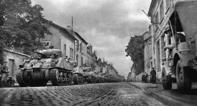 Shermans line up in an unidentified French city, September 27, 1944, in preparation for a continuation of the drive toward the German border.