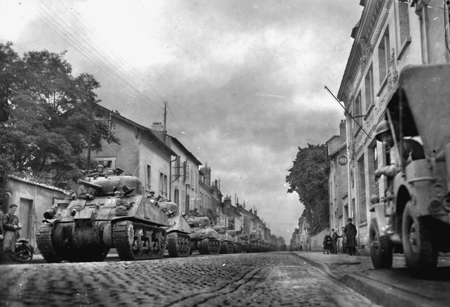 Shermans line up in an unidentified French city, September 27, 1944, in preparation for a continuation of the drive toward the German border.