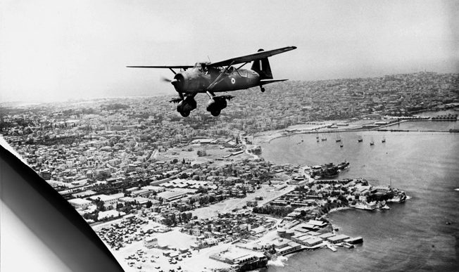 An RAF Westland Lysander Mark I flies over the Beirut waterfront shortly after the city fell to the British in July 1941.