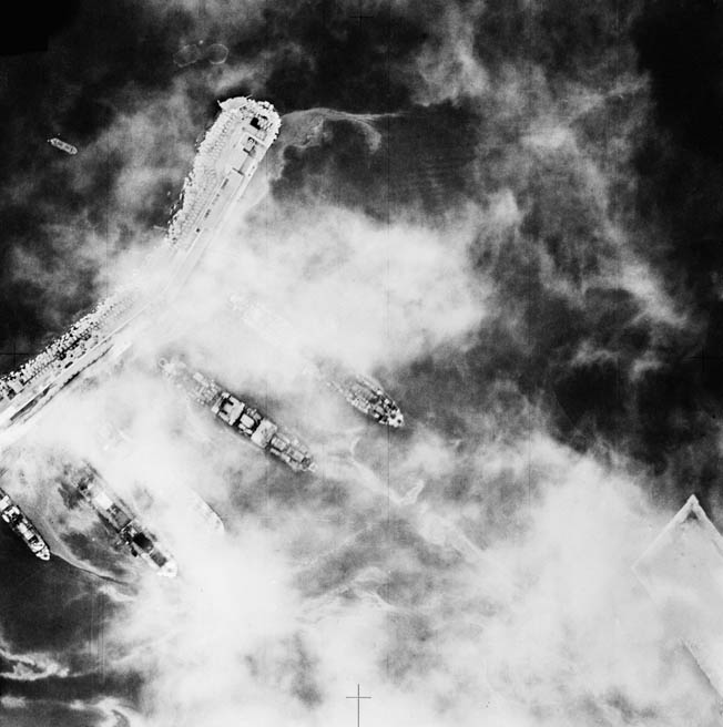 A British reconnaissance photo shows ships of an Italian convoy in the harbor at Palermo, Sicily. Two of the vessels were sunk and others damaged during a bombing raid two nights later. 