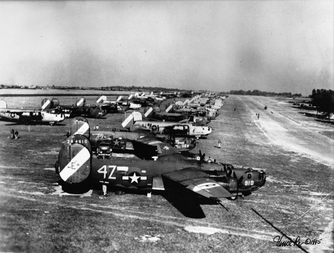 Bomber bases were anything but orderly. At Royal Air Force Rackheath, the 467th Bombardment Group kept its B-24 Liberators on soft grass. The bombers in the foreground in this image, including B-24H 42-94910, belong to the group’s 791st Bombardment Squadron. 