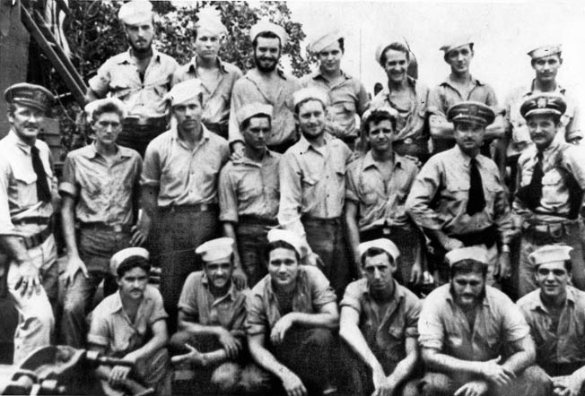 Lieutenant Thom (standing far left) with officers and men of PT boats 36 and 40. 