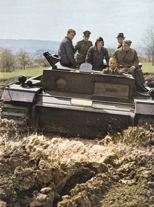 In this photo published in Signal magazine in August 1943, Albert Speer is shown at the wheel of a prototype tank.