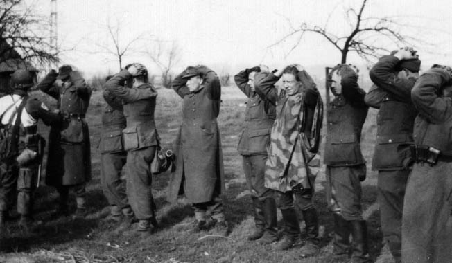 American airborne troops round up German prisoners during the operation.