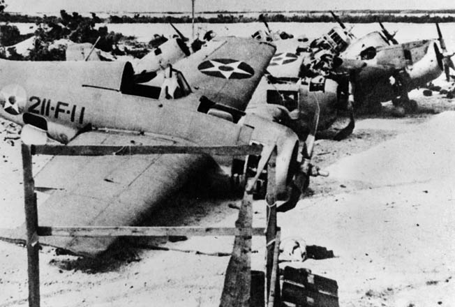 Seven of the destroyed F4F Wildcats of VMF-211 on Wake after the island fell. The plane in the foreground was flown by Elrod during his December 11 attack that sank the destroyer Kisaragi.