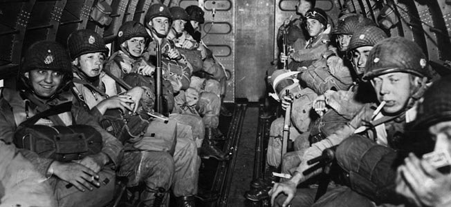 Their faces displaying a variety of emotions, these paratroopers from the 101st Airborne prepare to take off in a C-47 “Skytrain” on D-Day.