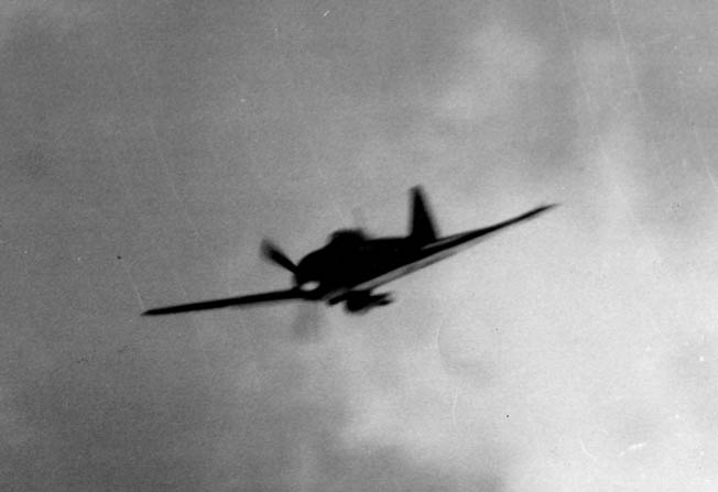 A bomb-laden kamikaze, scourge of the U.S. Navy, dives toward an American carrier. Crosby learned to keep his distance when firing on a kamikaze to avoid being caught in the explosion from the kamikaze’s load of TNT. 