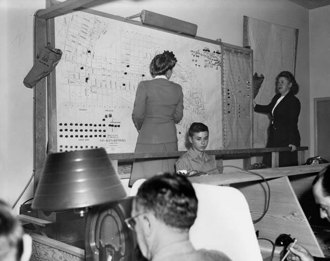 Civil defense measures were instituted to reduce panic. At this control center in Ventura, California, in 1943, workers prepare a large city map that would identify road blocks, unexploded bombs, poison gas attacks, and other possible war-related calamities.