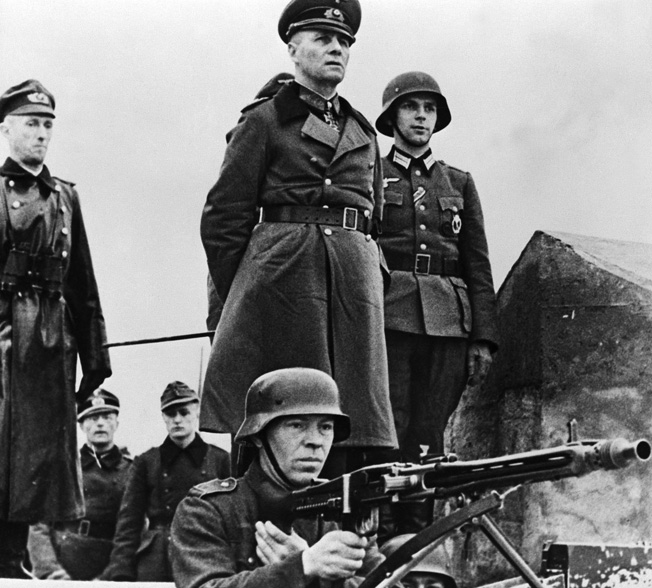 As head of Army Group B, Rommel was responsible for fortifying the French coast against invasion. Here he inspects German defenses in Normandy.