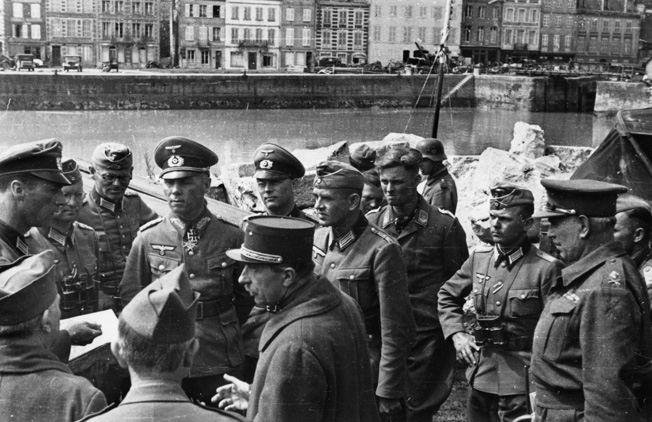 As commander of the 7th Panzer Division, Rommel accepts the surrender of French and British units during the invasion of France, 1940. 