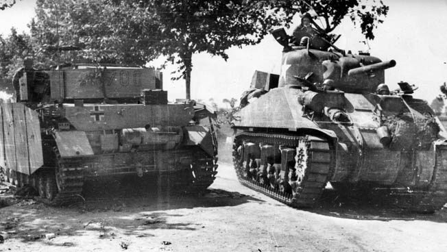 A Sherman tank advances past a destroyed German tank. The arrival of British and American reinforcements on September 14 gave the Allies additional strength and compelled the Germans to begin withdrawing toward Rome.