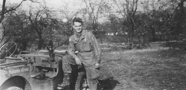 Captain C. Lenton “Charlie” Sartain, one of the heroes of Finger Ridge, photographed with his jeep, Indiana Anne, November 1944. 