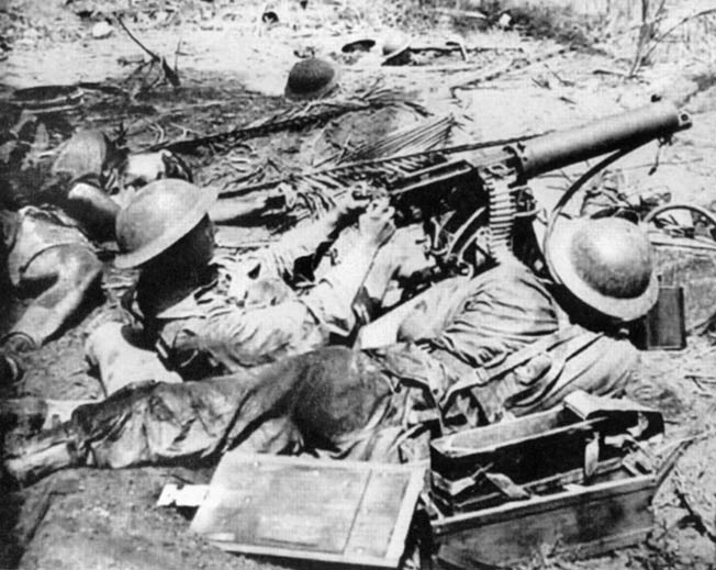 During heavy fighting at Buna, New Guinea, on January 1, 1943, George Silk took this photograph of Australian Diggers manning a Vickers machine gun. The Australians have recently taken Japanese sniper fire, which claimed the life of the soldier sprawled at far left. This photo was initially suppressed by Australian government censors.