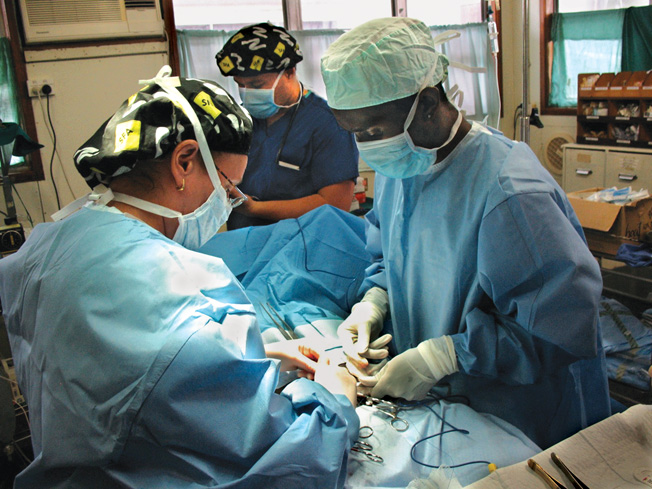 One of the Loloma Foundation’s missions is to teach local doctors to perform surgery. Here the author (left) instructs Dr. Andrew Soma in a hernia repair. 