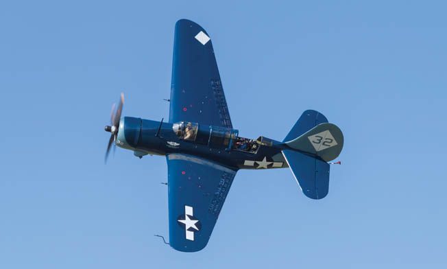 On June 1, 2013, the Commemorative Air Force’s Curtiss SB2C-5 Helldiver goes into the “break” on approach to an airfield at Manassas, Virginia, with pilot Ed Vesely at the controls and author Robert F. Dorr in the rear seat. This Helldiver is the only one in the world that remains in airworthy condition today