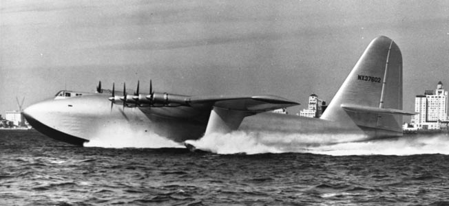 The 300,000 pound H-4 Hercules (aka “Spruce Goose”) kicks up a wake as its eight engines attempt to lift off from Long Beach (California) Harbor on its one and only flight, November 2, 1947—more than two years after the war. 