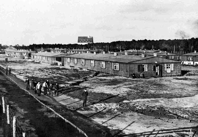 The Stalag Luft III compound near Sagan, Silesia, with prisoners taking their “daily constitutional” along a route inside the barbed wire. This camp was where “the Great Escape” occurred in March 1944—before Boam’s arrival.