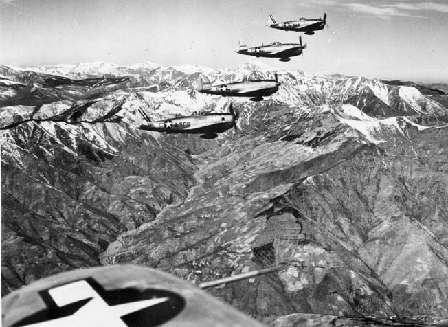 P-47 Thunderbolt fighter bombers with belly fuel tanks en route to an attack in Italy’s Northern Apennine Mountains, April 1945.