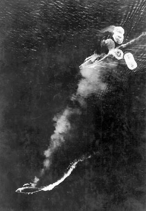 At one point a reconnaissance aircraft, piloted by Lieutenant H. Takeda, flew over the foamy wake of two large ships and immediately banked away unseen to get off a sighting report.