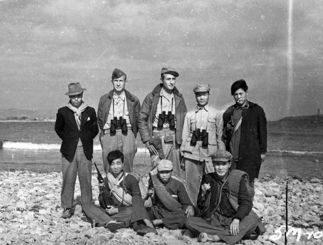 Photographed on the coast of eastern China in early 1945, these U.S. Navy officers and Chinese guerrillas assigned to SACO give the appearance of seasoned veterans in intelligence gathering and the covert war with the Japanese on the Asian continent.