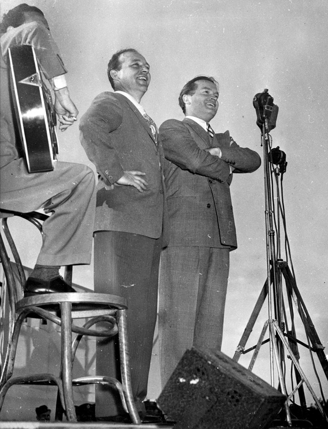 Bing Crosby and Bob Hope perform for military personnell at an air base in California in February 1944. They were but two of hundreds of big-name and little-known performers who volunteered their services to the USO.