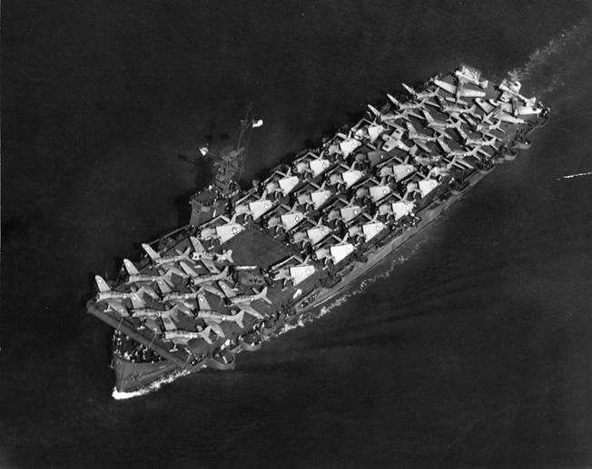 Dorie Miller lost his life when the escort carrier Liscome Bay was torpedoed in the Gilbert Islands on November 23, 1943. This photo of the Liscome Bay was taken two months before and shows the carrier with its decks full of Douglas SBD Dauntless dive bombers and Grumman TBF Avenger torpedo planes.