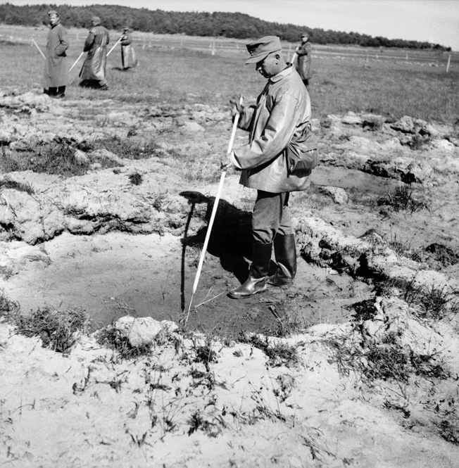 German prisoners engage in postwar mine-clearance work near Stavanger, Norway, August 1945. While most German POWs were repatriated after the war, some were held and required to perform such duties temporarily.