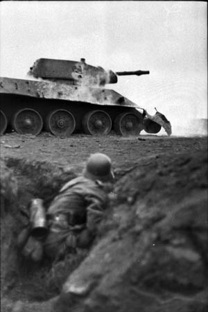 A German soldier practices assaulting a disabled Russian T-34 tank during field training in the Ukraine in the spring of 1944. Engler was wounded for a second time during a tank battle in the Ukraine in March 1944.