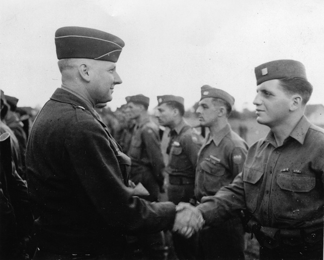 Brig. Gen. Andrew Tychsen, assistant commander of the 100th, awards the Bronze Star for Valor to the author, June 1945, at Kirschheim, Germany.