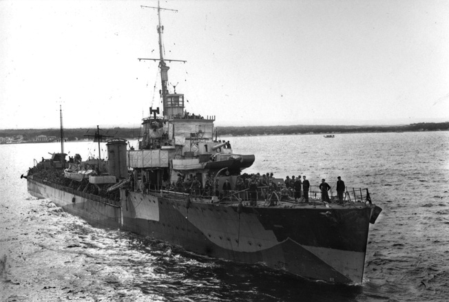 The British destroyer Malcolm is shown with a complement of American soldiers aboard. Malcolm was severely damaged during Operation Terminal and did not enter the harbor at Algiers until November 10, two days after the commencement of Operation Torch, the Allied landings in North Africa.