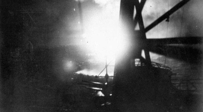 A Japanese combat photographer snapped this image of the Battle of Savo Island from the deck of the crusier Chokai. Flares light up the dark sky and silhouette the cruisers USS Chicago and HMAS Canberra.