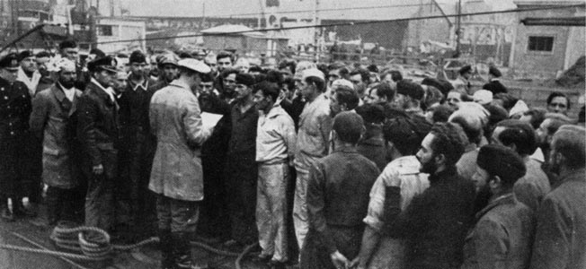 Passengers rescued from the sunken liner Zam Zam sit or stand among their salvaged luggage aboard Atlantis and await instructions from their German hosts. The majority of the Zam Zam passengers were eventually delivered to the supply ship Dresden. 