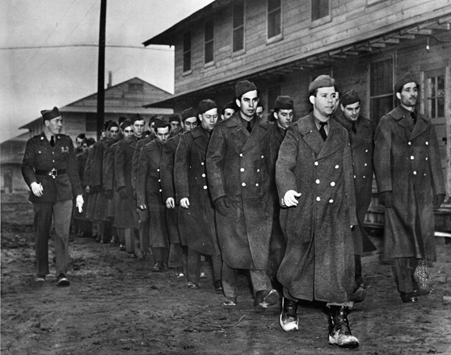 The Bedford Boys arrived at Fort Meade, Maryland, in February 1940 and underwent arduous training. These soldiers are participating in close-order drill in preparation for deployment to Europe. 