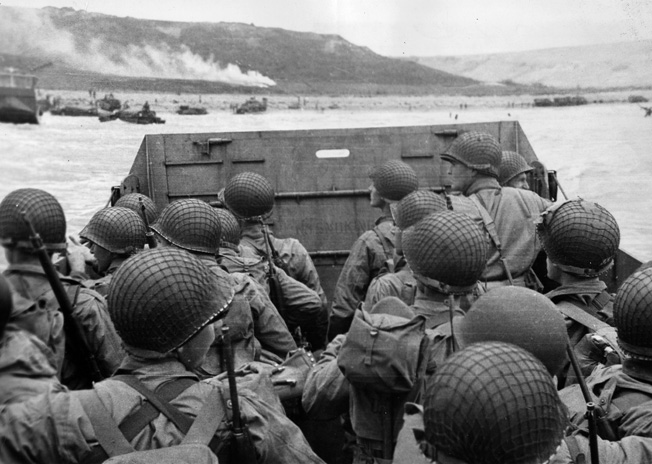 As their landing craft bobs and weaves its way toward Omaha Beach, American soldiers observe the chaotic maelstrom of combat into which they are about to plunge. 