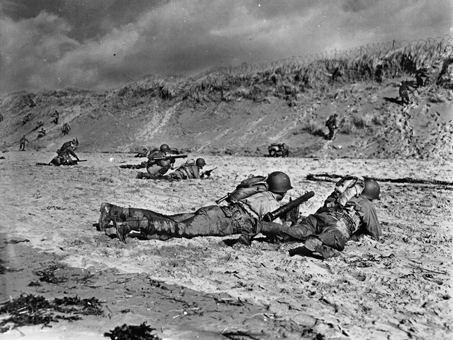 A two-man bazooka team takes aim at a distant target during training exercises on a British beach in October 1943. The 29th Infantry Division underwent extensive training in preparation for D-Day.